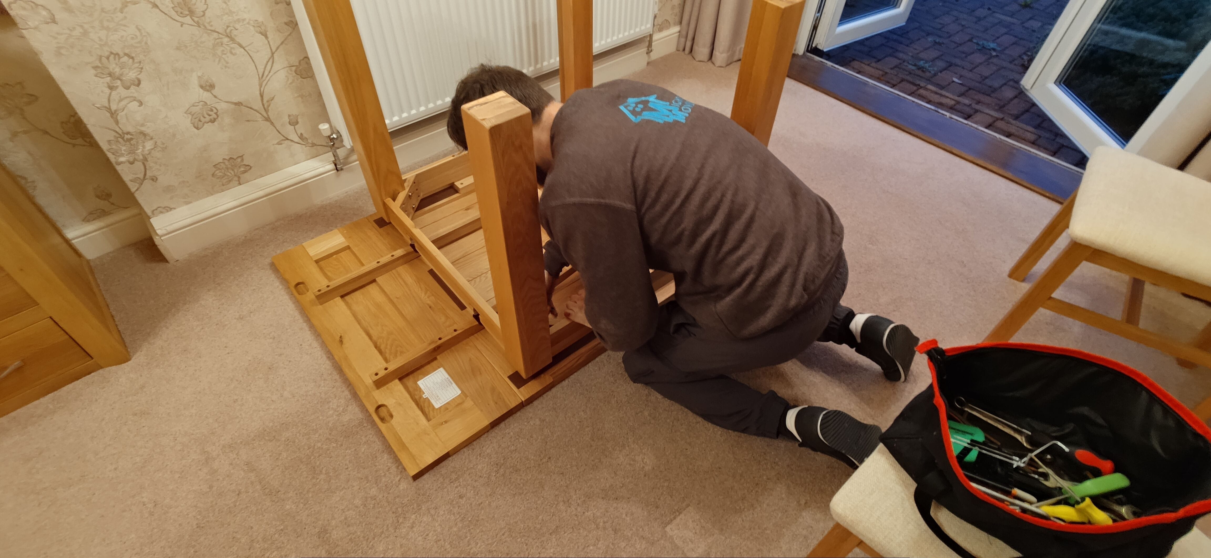 Staff assembling a dining table